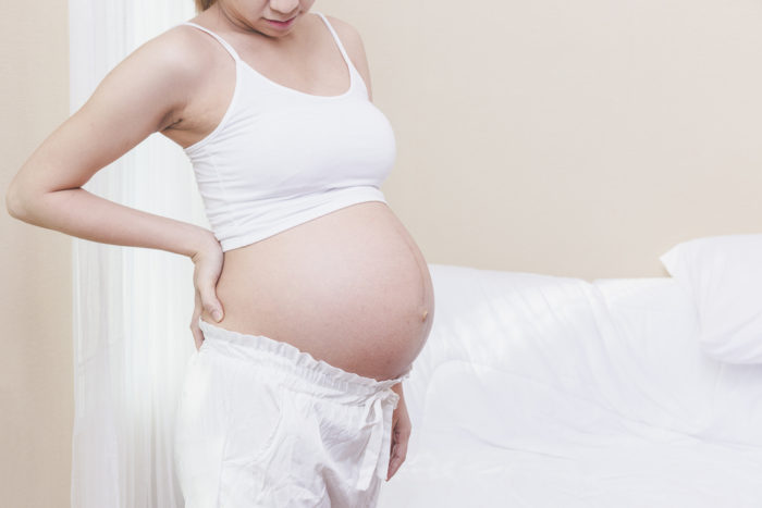rugpijn tijdens de zwangerschap met behulp van verwarmingspad
